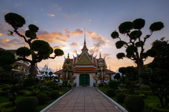 Inside main entrance of Wat Arun temple  in Bangkok, Thailand during sunset.