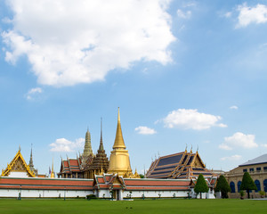 Grand palace and Wat phra keaw in Bangkok, Thailand, Southeast Asia - Fancy and colorful exterior architecture design. Famous attraction for tourists. Sunny weather. Popular place for sightseeing.