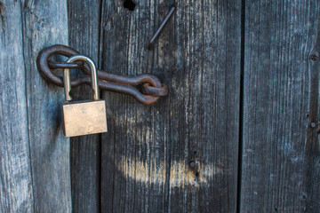 lock on old wooden door close-up