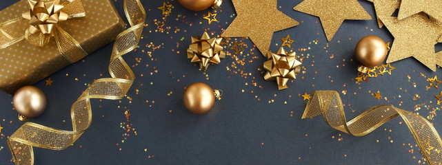 christmas or new year banner frame decorations in gold colors on dark blue background with empty...