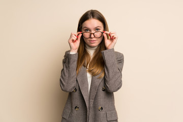 Young business woman with glasses and surprised