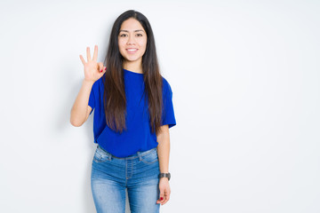 Beautiful brunette woman over isolated background showing and pointing up with fingers number three while smiling confident and happy.