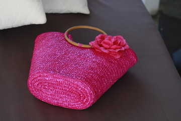pink women's bag with rose
