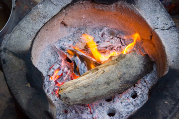 Charcoal to cook for breakfast with old wood. Thailand, Asia