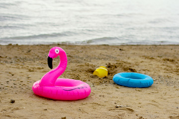  inflatable toys on a sandy beach