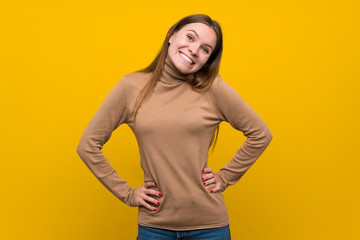Young woman over colorful background proud and self-satisfied