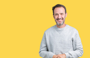 Handsome middle age senior man wearing a sweatshirt over isolated background Hands together and fingers crossed smiling relaxed and cheerful. Success and optimistic