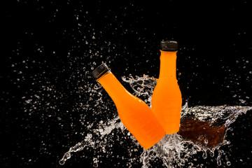 Orange juice, orange juice bottle with splash water Refreshing ideas to solve thirst