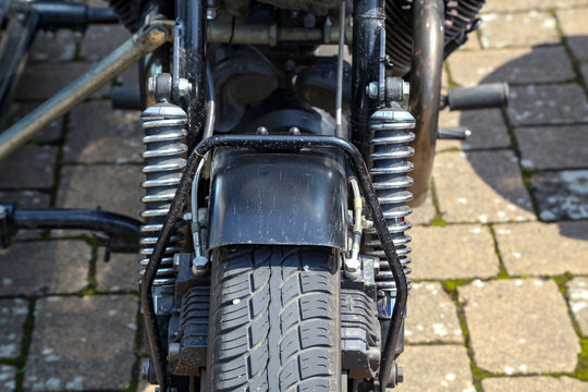 Details of a motorcycle with a stroller