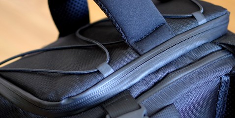 Black waterproof camera backpack zipper