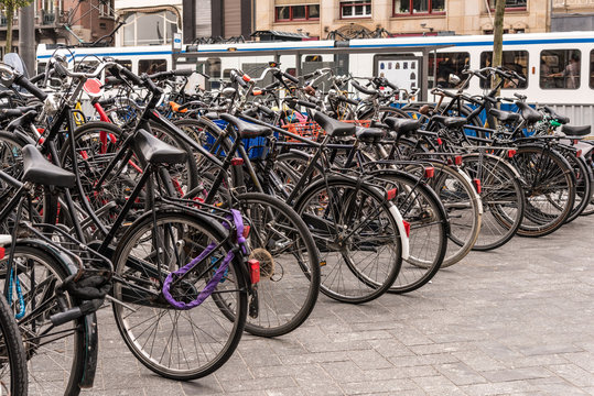 People are using bike for transport in Amsterdam, Netherlands to avoid the air pollution, to move easily in the city and they don't need many parking place too