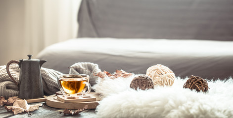 Cozy autumn still life with a cup of tea