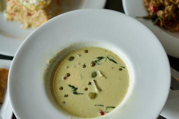 Thai chicken green curry on table