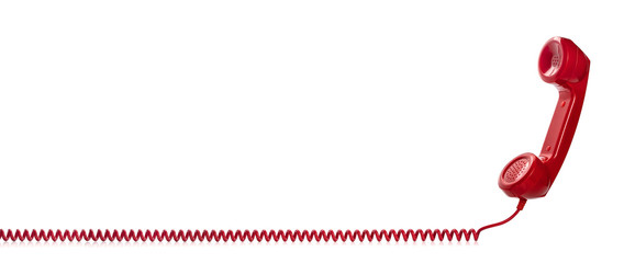 Combiné téléphonique rétro rouge isolé sur fond blanc