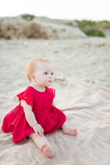 Beautiful little sitting on the beach