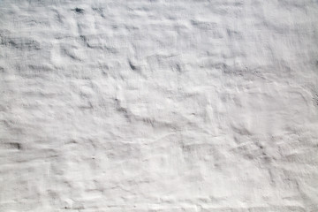 The background of the wall is white whitewashed with uneven surface. Place text to review concepts. Backgrounds texture design.
