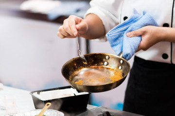 Chef cooking food in the kitchen, Chef preparing food