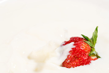 juicy strawberries in milk, falling strawberries