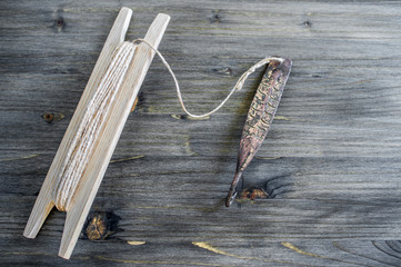 Ancient tackle for vertical flashing predatory fish. Copper forged spinner and reel with rope on...