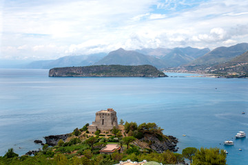 Fototapeta na wymiar Dino island Praia a Mare and Crawford tower San Nicola Arcella. Mediterranean sea, Calabria, Italy