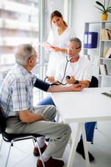 Fototapeta premium Offering his expert advice to his patient