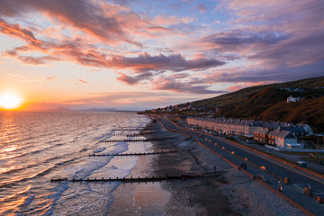 Stormy Sunset over Coastal Town in North Wales,UK