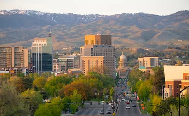 Foto op Plexiglas The Idaho State Capital Building Peaks Out Between Structures in Boise © Christopher Boswell