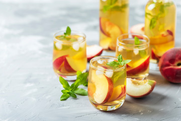 Summer cold tea with peaches and mint