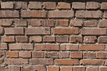 Cracked old red brick wall texture