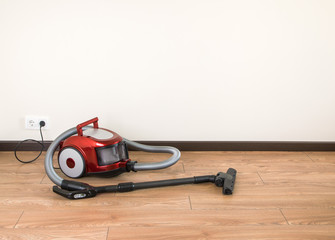 vacuum cleaner is standing on the floor