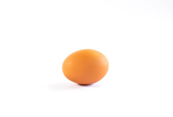 Closeup of raw egg on white background