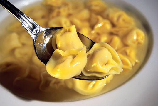Freshly boiled tortellini with broth