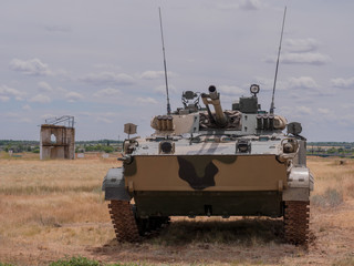 heavy tanks shoot guns and machine guns at combat positions