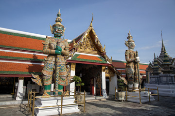 Fototapeta premium Giant Demon Guardian Standing in Front of Wat Phra Kaew (Grand Palace) Door in Bangkok Thailand
