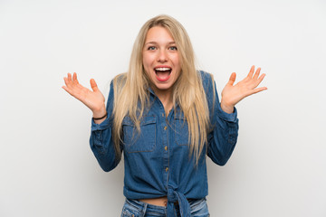 Fototapeta na wymiar Young blonde woman over isolated white wall with shocked facial expression