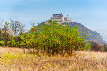 Fototapeta na wymiar Autumn landscape with Deva citadel, view from the hill