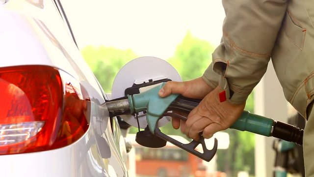 Refueling car at the refuel station on sunrise light