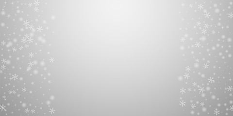 Sparse glowing snow Christmas background. Subtle f