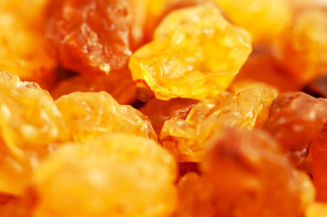 a handful of raisins on a white macro background