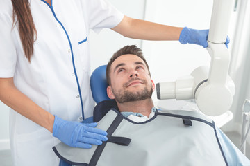 Dentist takes an x-ray picture of the tooth