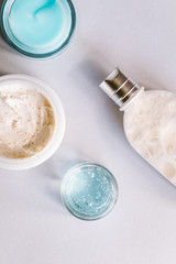 Female skin and body care cosmetic products set flatlay. Overhead, minimalism, beauty blogging concept
