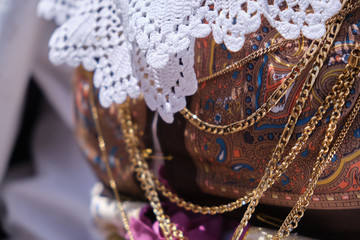 A woman dressed in typical Sardinian costume with different Sardinian ornamental golden jewels.
