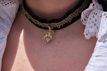 A woman dressed in typical Sardinian costume with different Sardinian ornamental golden jewels.