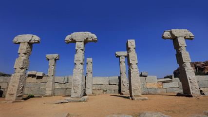 Tall pillars in runes of historic Hampi