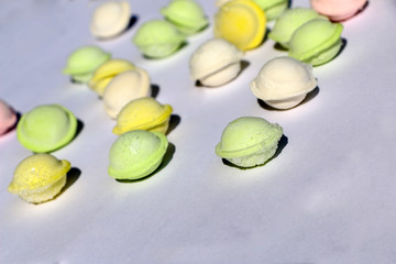 small colored dumplings on white background. food for children, festive and Christmas parties.