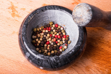 Mix of peppers in a stone mortar