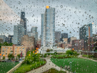 Selective Focus Shot of the Chicago Skyline on a Rainy Day - with Raindrops on the Window in Focus