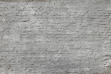 Texture of gray, plastered brick wall.
