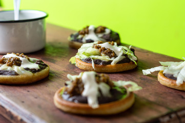 mexican vegetarian sopes made with black refried beans