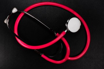 Stethoscopes are among the most important tools a nurse or doctor on black background